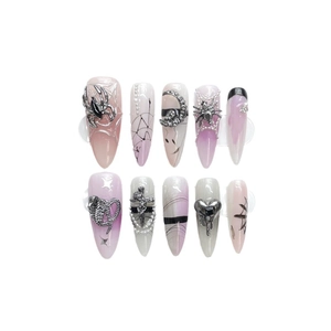 Gothic press-on nails with 3D silver spider, skull and heart charms on pink gradient