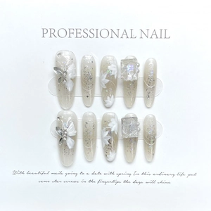 Handmade silver press-on nails with 3D floral carving and large square rhinestone accents