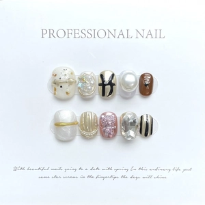 Handmade press-on nails featuring 3D pink bears, pearls and gold metallic fluid accents