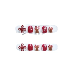 Handmade Chinese knot press-on nails for kids in festive red and white with 3D embossed art