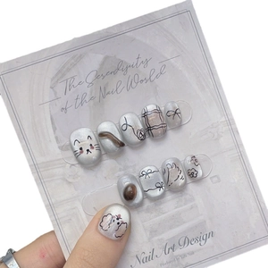 Handmade silver cat-eye press-on nails with cute hand-painted cat and floral patterns