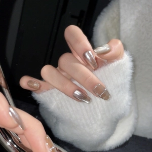 Handmade cat-eye press-on nails in champagne gold and silver metallic mirror finish