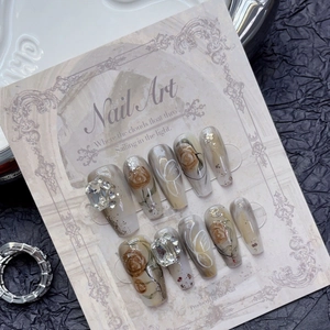 Handmade press-on nails with ink peony art, marble dye, and luxury rhinestones