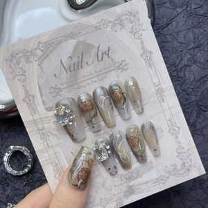 Press-on nails with ink peony design, amber rose art, and sparkling crystals