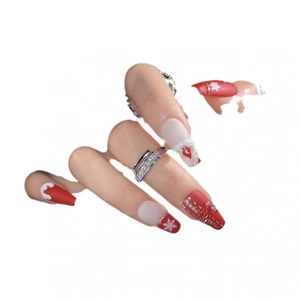 Christmas nail art stickers featuring red and white snowflakes and gift box designs