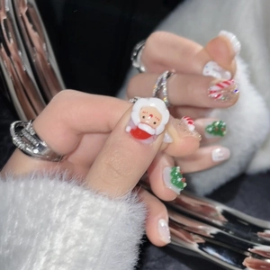 Handmade 3D Santa Claus press-on nails set with festive Christmas tree and candy cane designs