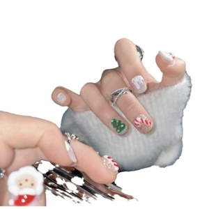 Handmade 3D Christmas press-on nails featuring Santa, candy canes, and festive glitter