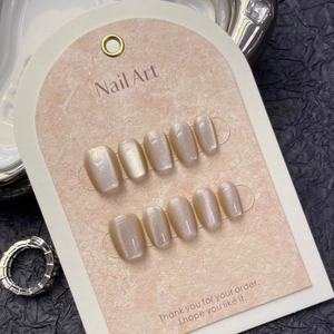 Champagne cat eye press-on nails set with 10 pieces on display card with metallic accents