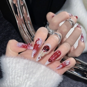 Long stiletto Christmas press-on nails with red white snowflake and heart charms