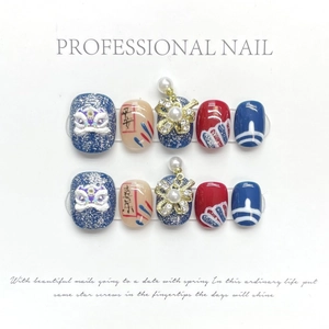 Handmade cat-eye press-on nails with Chinese lion dance design and pearl charms