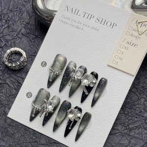 Handmade silver cat-eye stiletto press-on nails with 3D butterfly and rhinestone accents