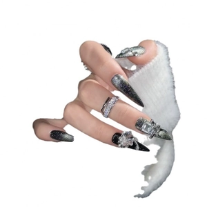 Long stiletto cat-eye press-on nails in black and grey gradient with rhinestones