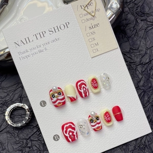 Handmade red press-on nails with 3D lion dance motif and festive Fu character patterns