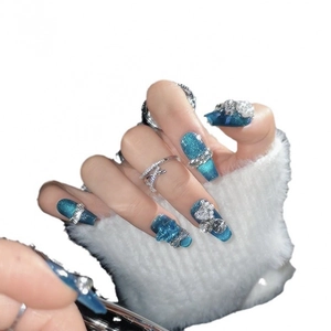 Sparkling dark blue cat-eye press-on nails with luxury rhinestones and bow accents