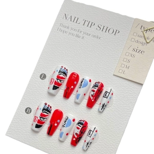 Handmade press-on nails featuring Chinese opera face masks and traditional red and black art