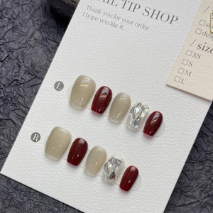 Handmade cat-eye press-on nails in rose red and nude with rhinestones and glitter