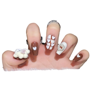 Brown and white press-on nails featuring 3D flocked bears, hearts, and plaid patterns