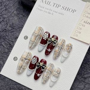 Luxury tweed pattern press-on nails with wine red accents, pearls and bow decoration
