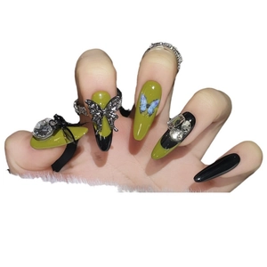 Handmade almond press-on nails with olive green butterfly designs and sparkling rhinestones