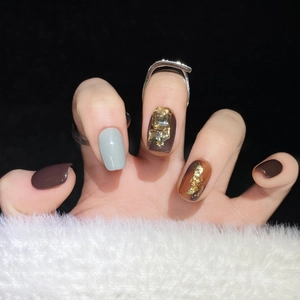 Handmade press-on nails in brown amber with gold foil and crystal rhinestone accents