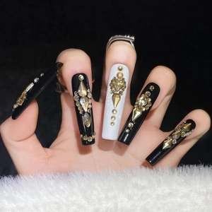 Elegant extra-long coffin press-on nails with black and white gems and gold accents