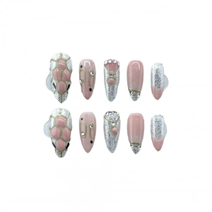 Pink and silver press-on nails with snake pattern and rhinestones in long almond shape