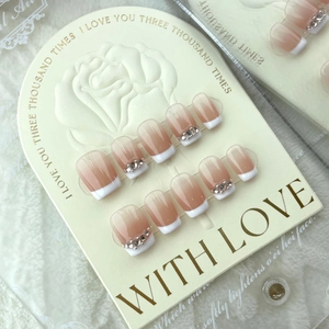 French gradient nude nails with rhinestones and white tips on elegant rose display card