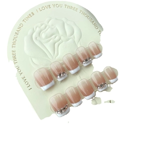 French gradient square press-on nails in nude pink and white with sparkling rhinestones