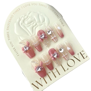 Pink gradient coffin press-on nails with plaid patterns and 3D bow heart diamond accents