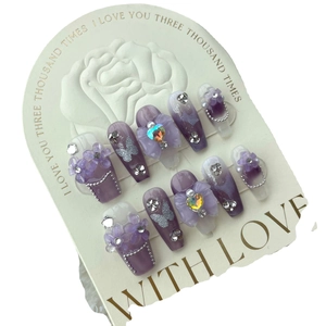 Handmade purple galaxy press-on nails set with 3D floral accents and crystal rhinestones