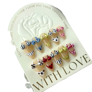 Handmade stiletto press-on nails featuring creative 3D bikini patterns and pop art motifs