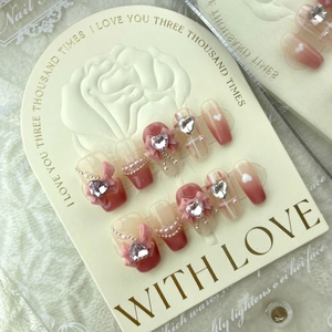 Handmade pink gradient press-on nails with 3D bows, silver heart rhinestones and pearls