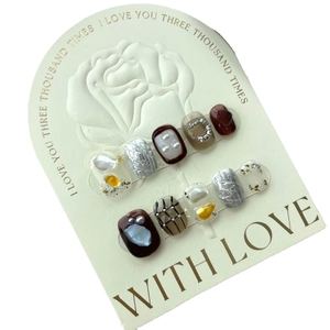 Brown diamond pattern press-on nails with pearls, gold foil, and 3D leaf relief texture