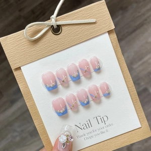 Pink and blue handmade press-on nails with 3D flower and pearl jewelry accents