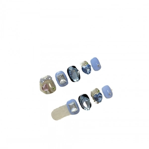 Short blue and black handmade press-on nails with blue gems and heart crystal accents