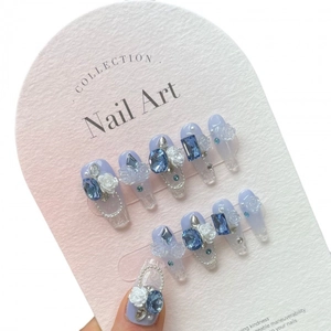 Handmade translucent lavender and blue gradient press-on nails with 3D resin roses and crystals