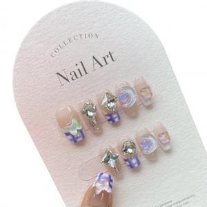 Handmade purple checkerboard press-on nails with 3D butterfly charms and crystal gems