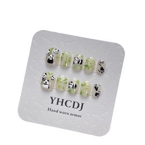 Hand-painted panda and bamboo press-on nails set with 10 pieces on white background