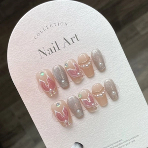 Handmade Mermaid Princess press-on nails with bow details and pearls on a display card