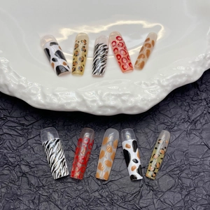 Extra long leopard and zebra print press-on nails with glossy animal pattern finish