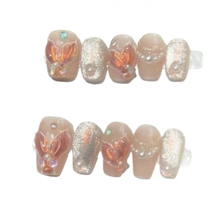 Handmade mermaid style pink press-on nails with 3D fish tail and pearl accents