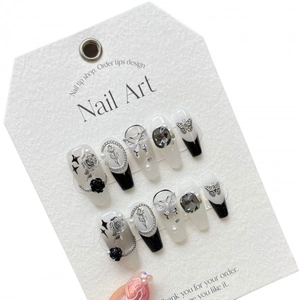 Handmade butterfly press-on nails with crystals, chains and black-white French tips