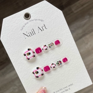 Press-on toenails featuring rose red, leopard print, and colorful star sequins on cards