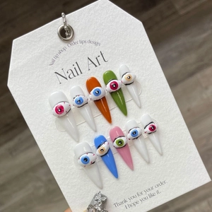 Handmade 3D evil eye press-on nails set with colorful graffiti art on display card