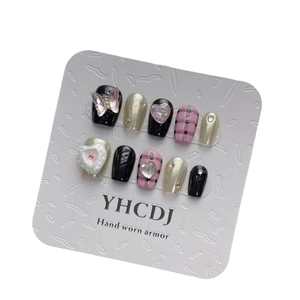 Handmade black and pink plaid press-on nails with 3D butterfly and pearl accents
