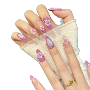 Handmade stiletto press-on nails with 3D purple and white flowers and gold bead accents