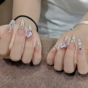 Silver mirror chrome press-on nails with 3D pink heart rhinestones and French tip style