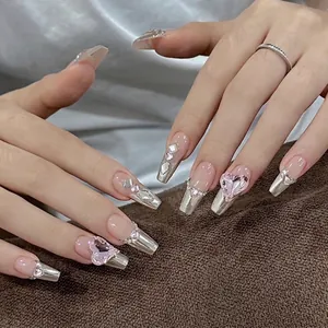 Silver French press-on nails with pink heart rhinestones and long trapezoid shape