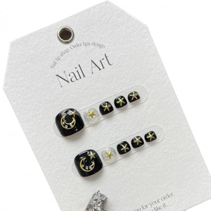 Moon and star theme press-on toenails with glossy black finish and silver glitter accents