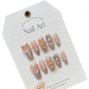 Pink ballet press-on nails with silver french tips, 3D golden bows and crystal accents